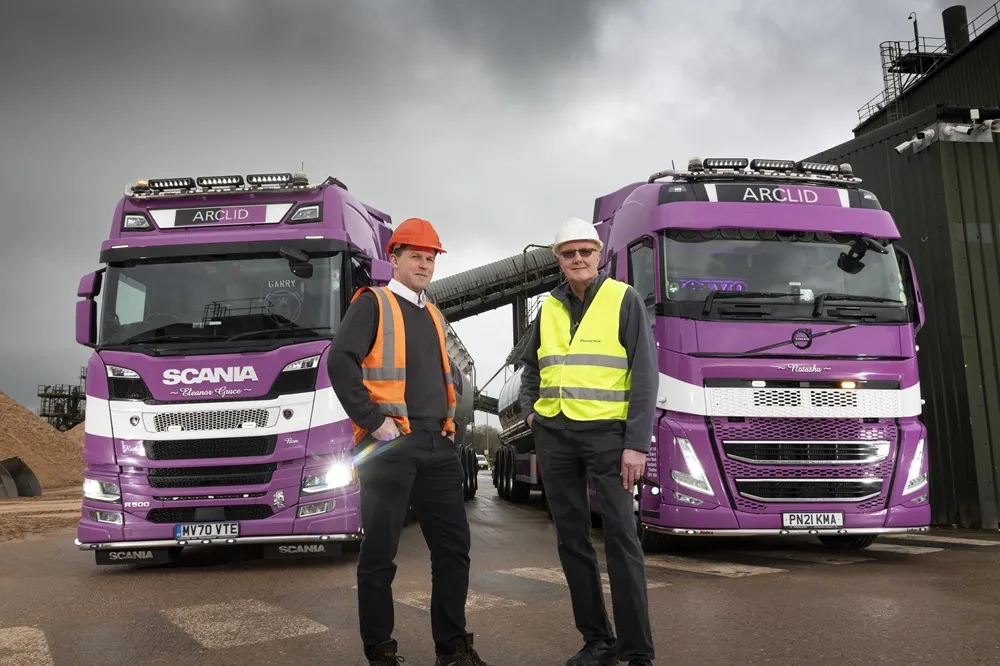 Andy Robinson and Gary Lane infront of a couple of Arclid Transport trucks