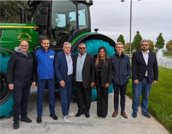 Seven Magri Group and GRi employes infront of a green tractor