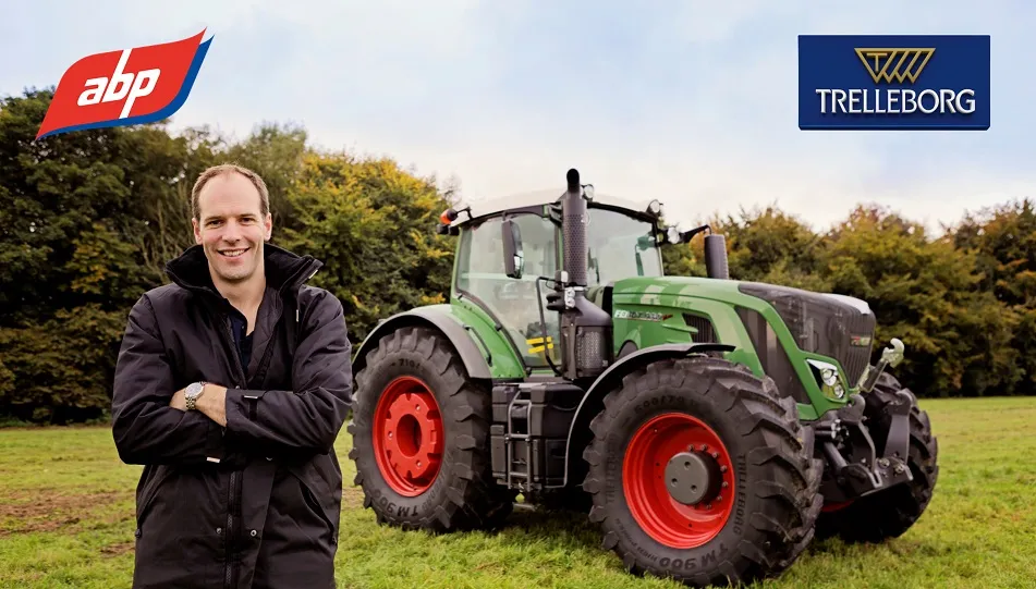 Image of a white man in a field, stood infront of a green tractor with ABP and Trelleborg tyre logos in the top corners.