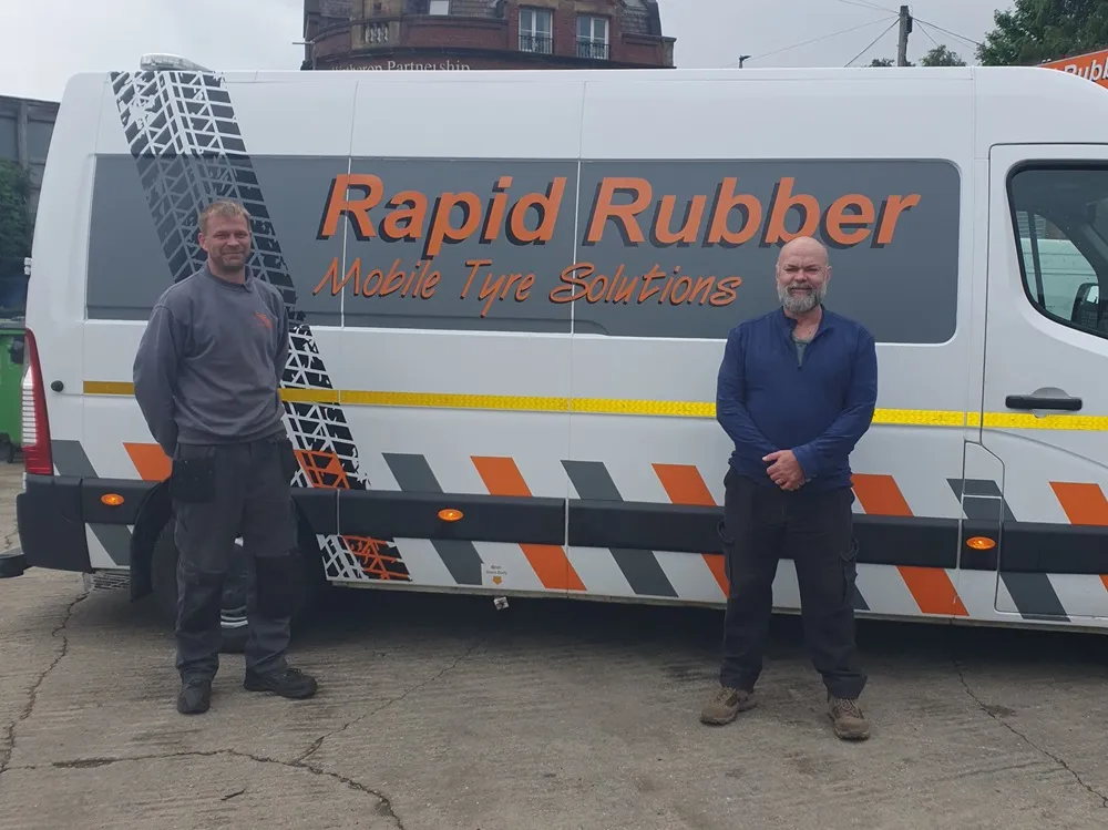 Men stood outside the Rapid Rubber van