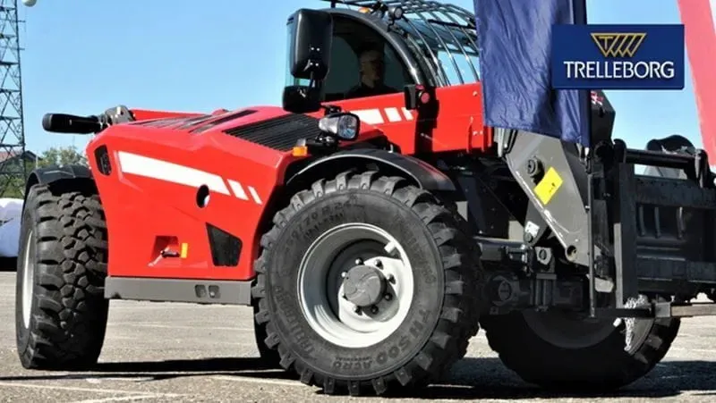 Close up of agricultural tyre on a red tractor