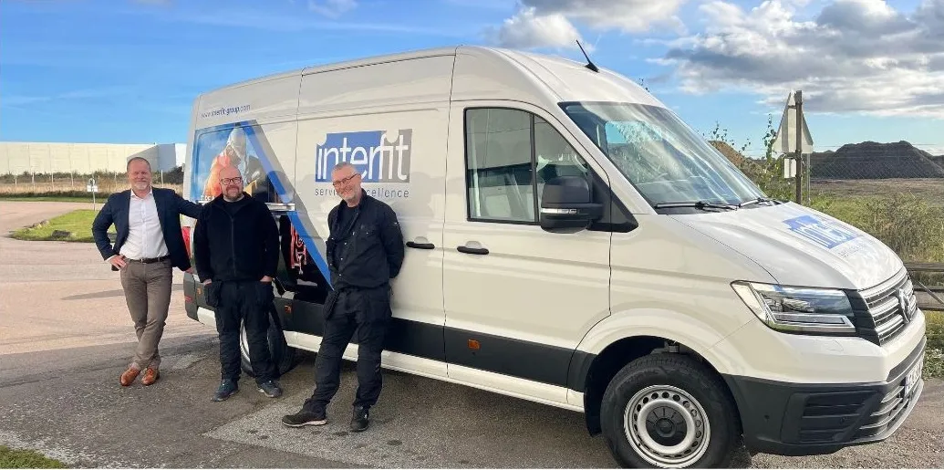 Interfit Van with three Interfit People Stood Outside