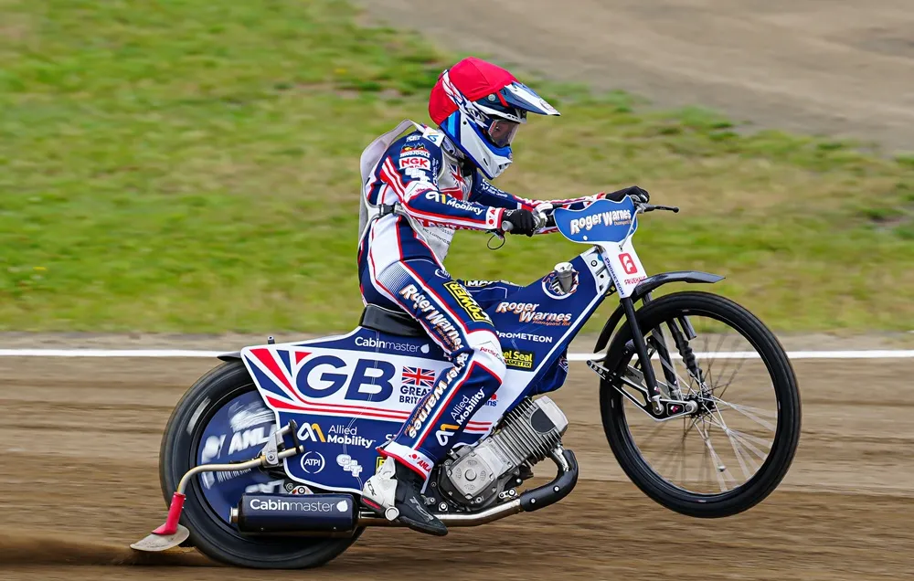 GB Speedway bike racing on a dirt track.