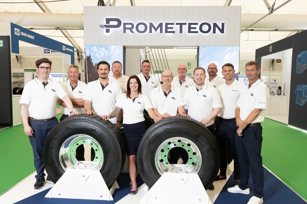 Prometeon RTX 2025 Team standing in front of a pair of tyres