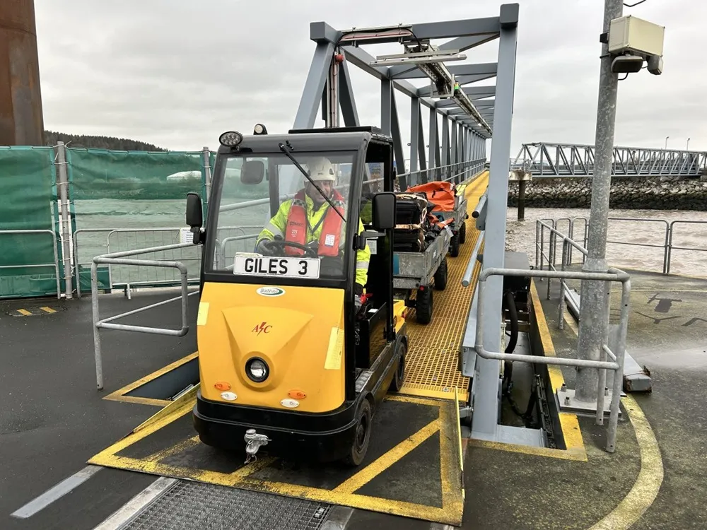Small tractor front view at windfarm location in Wales